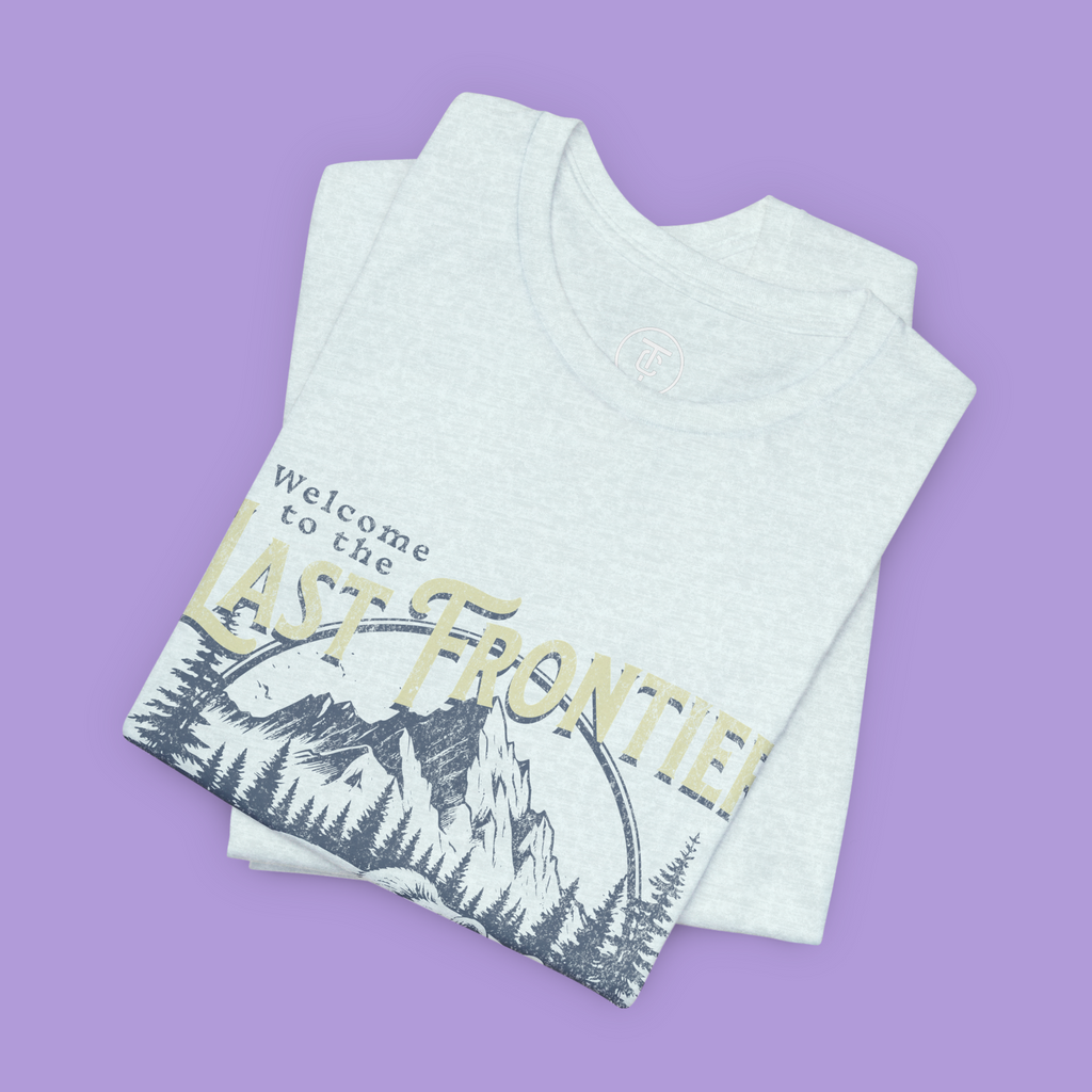 "Retro wilderness graphic tee featuring grizzly bear and alpine scenery"