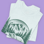 "Retro wilderness bear tee featuring Alaska mountains and pine forest design"