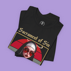 Close-up of Pop Art Goth shirt showing the nun's seductive look against the red/gray circle background.