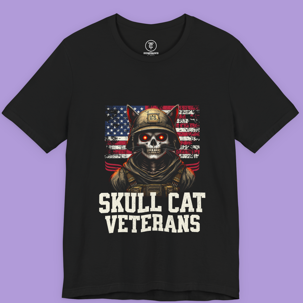 "Skull Cat Veterans T-shirt featuring a skull-faced cat soldier in a U.S. flag backdrop – patriotic gothic graphic tee on Bella+Canvas 3001."