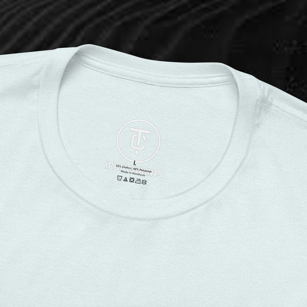A close-up of the inside collar of a  cotton t-shirt from Ironchain 19. The tagless printed label features a sleek white logo with a chain illustration, surrounded by number19 . Below the logo, the text indicates the shirt is 100% cotton, made in Bangladesh, and includes washing care symbols. The soft fabric and seamless neckline highlight the premium quality and comfort of this Gothic aesthetics  perfect for cat lovers and fans of modern streetwear fashion.