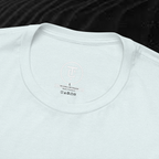 A close-up of the inside collar of a  cotton t-shirt from Ironchain 19. The tagless printed label features a sleek white logo with a chain illustration, surrounded by number19 . Below the logo, the text indicates the shirt is 100% cotton, made in Bangladesh, and includes washing care symbols. The soft fabric and seamless neckline highlight the premium quality and comfort of this Gothic aesthetics  perfect for cat lovers and fans of modern streetwear fashion.