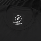 A close-up of the inside collar of a  cotton t-shirt from Ironchain 19. The tagless printed label features a sleek white logo with a chain illustration, surrounded by number19 . Below the logo, the text indicates the shirt is 100% cotton, made in Bangladesh, and includes washing care symbols. The soft fabric and seamless neckline highlight the premium quality and comfort of this Gothic aesthetics  perfect for cat lovers and fans of modern streetwear fashion.