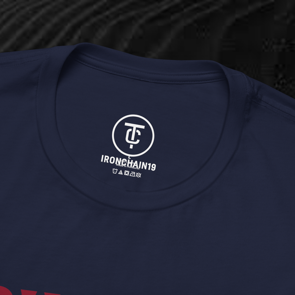 A close-up of the inside collar of a  cotton t-shirt from Ironchain 19. The tagless printed label features a sleek white logo with a chain illustration, surrounded by number19 . Below the logo, the text indicates the shirt is 100% cotton, made in Bangladesh, and includes washing care symbols. The soft fabric and seamless neckline highlight the premium quality and comfort of this Gothic aesthetics  perfect for cat lovers and fans of modern streetwear fashion.