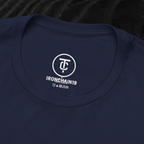 A close-up of the inside collar of a  cotton t-shirt from Ironchain 19. The tagless printed label features a sleek white logo with a chain illustration, surrounded by number19 . Below the logo, the text indicates the shirt is 100% cotton, made in Bangladesh, and includes washing care symbols. The soft fabric and seamless neckline highlight the premium quality and comfort of this Gothic aesthetics  perfect for cat lovers and fans of modern streetwear fashion.