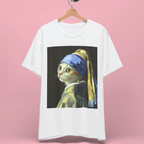Cat with Pearl Earring Graphic T-Shirt - A graphic t-shirt featuring a Vermeer satire hanging on a wooden hanger, pink background.
