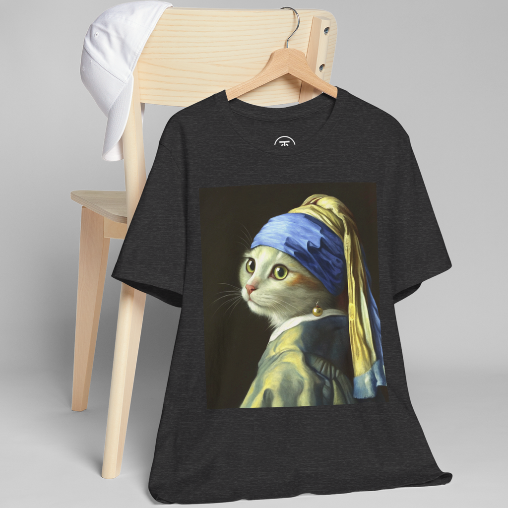 Detailed image of the Art Enthusiast T-shirt print with the cat's blue and yellow turban hangs on a chair.
