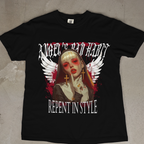 Close view of the nun's face and hands on the Angel's Bad Habit graphic tee, highlighting the cross jewelry.